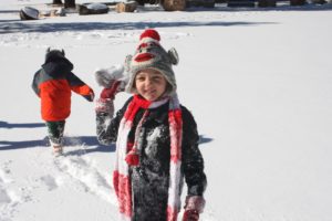 little boy playing in the snow: the miracle of adoption