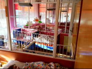 rows of cribs for young child