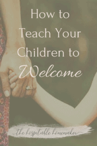 child holding mothers hand with text overlay how to teach your children to welcome 