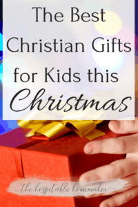 child with a Christmas present and text overlay - the best Christian gifts for Kids this Christmas
